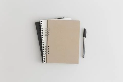 Notebook on grey background. Flat lay composition. Top view. Fotos de archivo