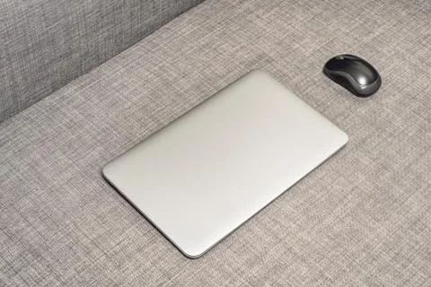 Notebook on the grey sofa Foto stock