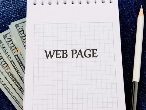 A notebook with grid paper features the words WEB PAGE prominently written. B Stock-Fotos