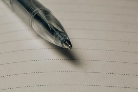 Notebook lines and the tip of a pen Stock Photos