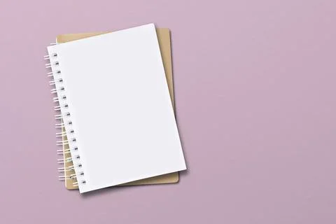 The notebook is located on a pink paper background. Stock Photos