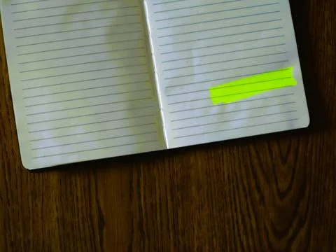 A notebook marked with colorful sticky notes for productive daily lifestyle Foto stock