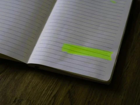 A notebook marked with colorful sticky notes for productive daily lifestyle Foto stock