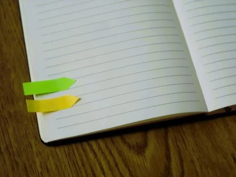 A notebook marked with colorful sticky notes for productive daily lifestyle Foto stock