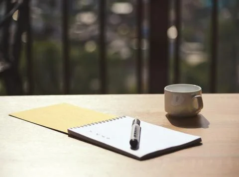 Notebook with a marker on the table in the cafe Stock Photos