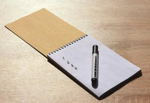 Notebook with a marker on the table Stock Photos