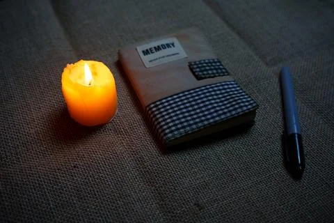 A notebook with memos in the candlelight Stock Photos