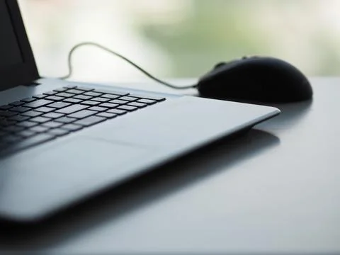 Notebook with mouse on the table Stock Photos