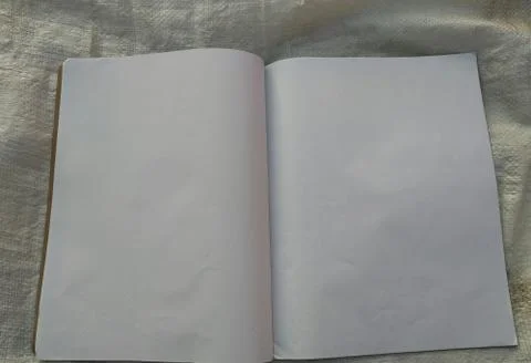 Notebook for notes in the red cover. With a red bookmark and pen Stock Photos