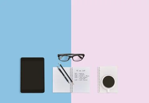 Notebook with notes, tablet eyeglasses and a cup of coffee on the desktop Stock-Fotos