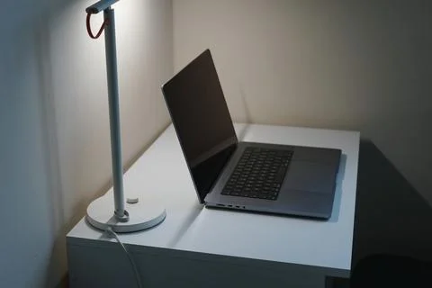 Notebook on office table with lamp light home office work study technology 스톡 사진