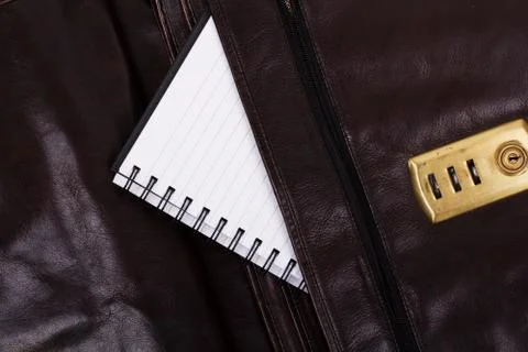 Notebook in an open brown leather briefcase Stock Photos
