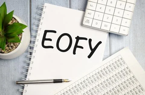 Notebook over wood table background, focus on wooden blocks with letters maki Stock Photos