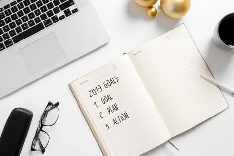 Notebook page with 2019 plan text white office desk table. Top view flatl lay Stock Photos