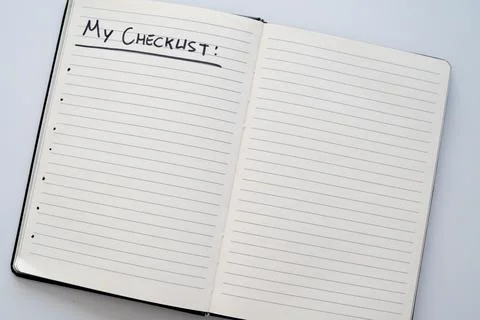 Notebook page marked 'my checklist' in black ink on white paper. Stock Photos