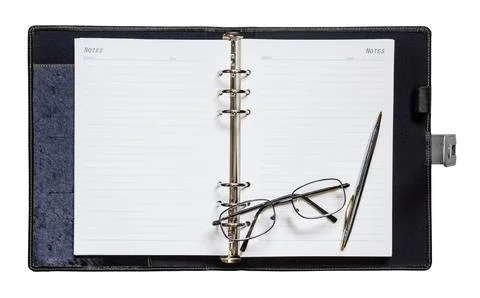 Notebook pen with glasses Stock Photos