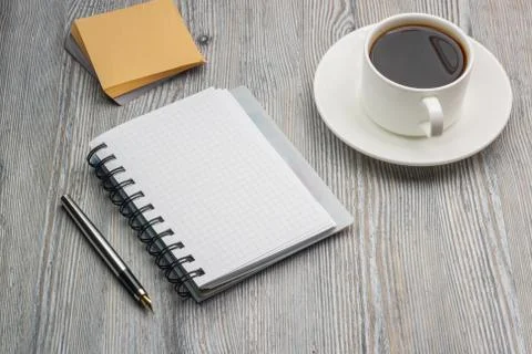Notebook with pen on an old rustic table. Scratch paper Stock Photos