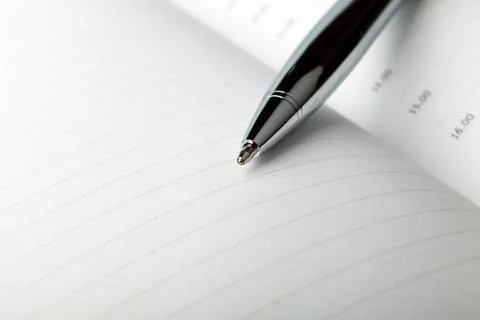 Notebook with pen Stock Photos