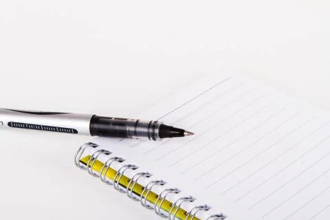 Notebook with pen Stock Photos