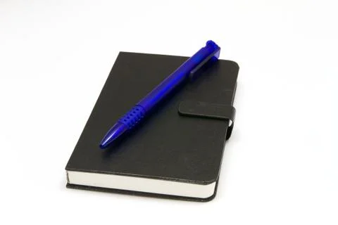 Notebook with pen Stock Photos