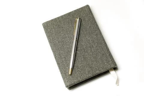 Notebook with pen Stock Photos