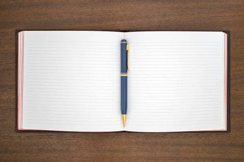 Notebook with pen on the table Stock Photos