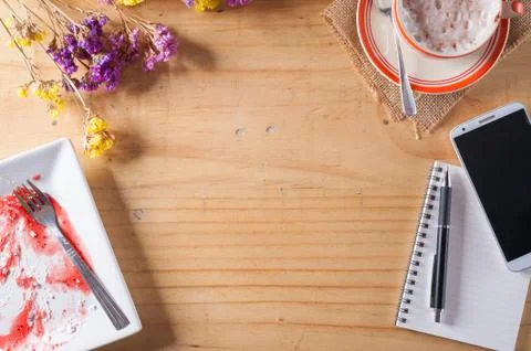 Notebook with pen on wood table Stock Photos