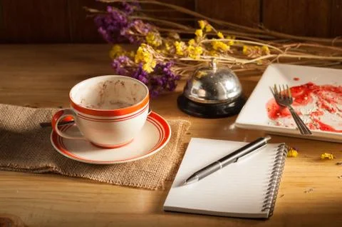 Notebook with pen on wood table Stock Photos
