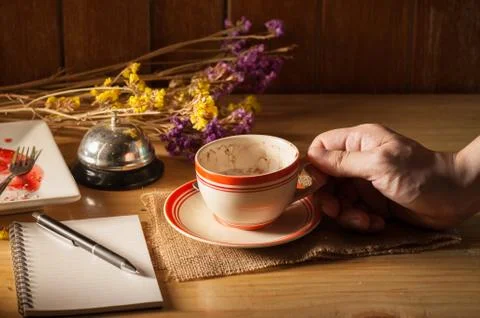Notebook with pen on wood table Stock Photos