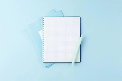 Notebook with pencil on blue table. Stock Photos