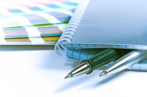Notebook, pens, color guide Stock Photos
