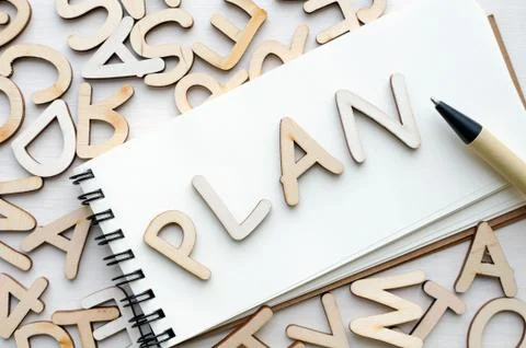 Notebook with plan letters and pen Stock Photos