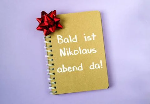 Notebook with a red bow on it Stock Photos