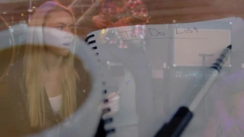 Notebook revealing To Do List and sparking faint music overlay for planning team Stock Footage 321889462