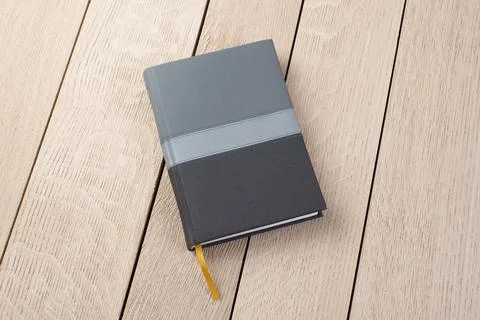 Notebook Scheluide on wooden background Stock Photos