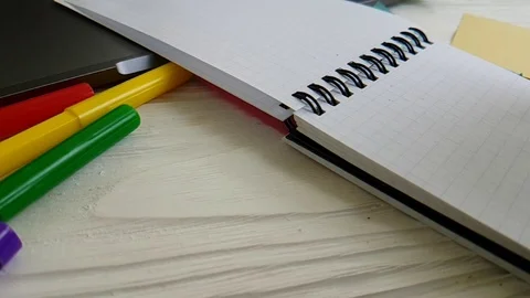 Notebook scratch pens on the desktop slow-motion shooting Stock Footage 90062458