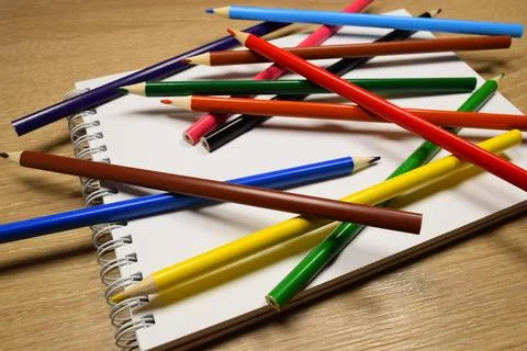 Notebook with a set of pencils Stock Photos