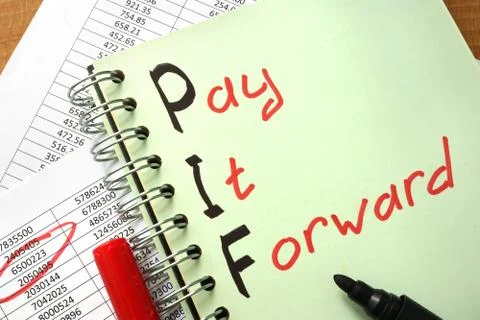 Notebook with  sign Pay It Forward PIF and charts. Stock Photos