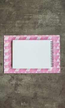 Notebook situating on working area Stock Photos