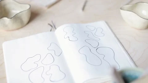 Notebook with sketches of clay design Stock Footage 107313217