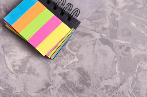Notebook with spiral and blank rectangle colored pages on old Foto stock