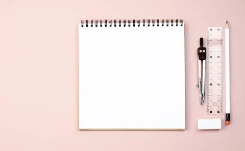 Notebook on a spring for drawing and writing on a pink background. Stock Photos