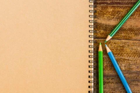 Notebook on table Stock Photos