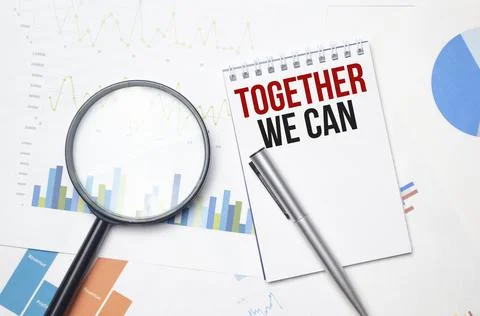 Notebook with text TOGETHER WE CAN . Diagram and white background,Business co Stock Photos