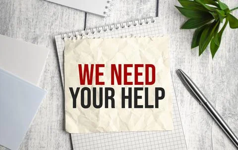 In the notebook the text we NEED YOUR HELP, Stock Photos