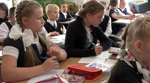 Notebook textbooks pencil case pens and pencils on the desks in front of the Stock Footage 65766563