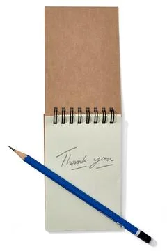 Notebook With Thank You Note and Blue Pencil on a Plain Background Showcasi.. Stock Photos
