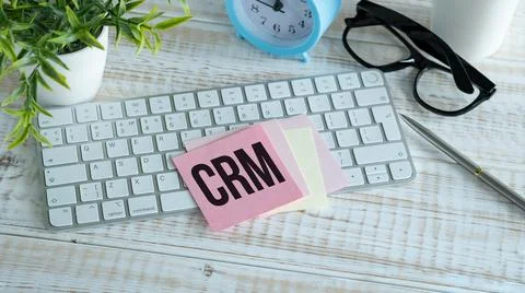 Notebook with Toolls and Notes about CRM on keyboard, business concept. Foto stock