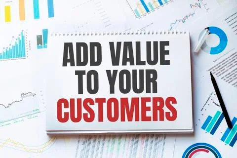 Notebook with Tools and Notes about ADD VALUE TO YOUR CUSTOMERS,concept 스톡 사진