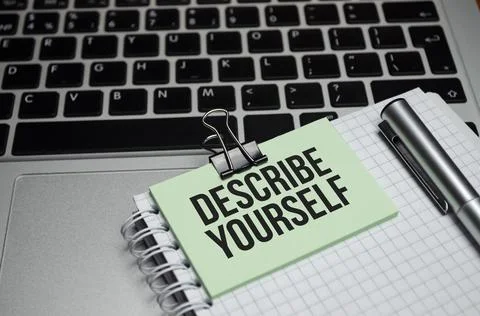 Notebook with Tools and Notes with text DESCRIBE YOURSELF Stock Photos